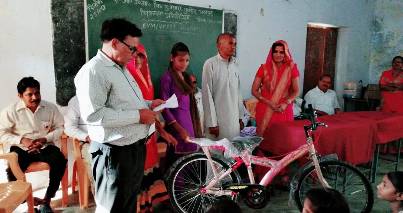 Bicycle presented to a schoolgirl at an SKL bicycle distribution event