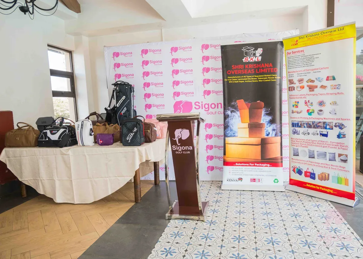 SKL banners and a table of golf bags and holdall prizes at the Sigona Golf Club Ladies Pendant prize-giving - 1