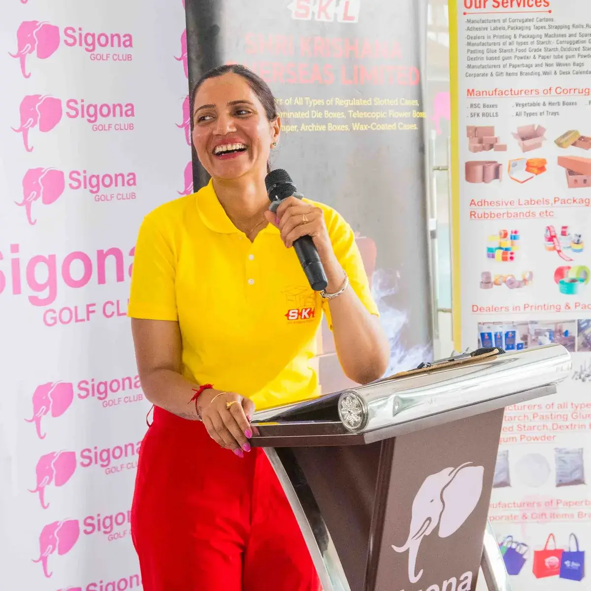 SKL banners and a table of golf bags and holdall prizes at the Sigona Golf Club Ladies Pendant prize-giving - 2